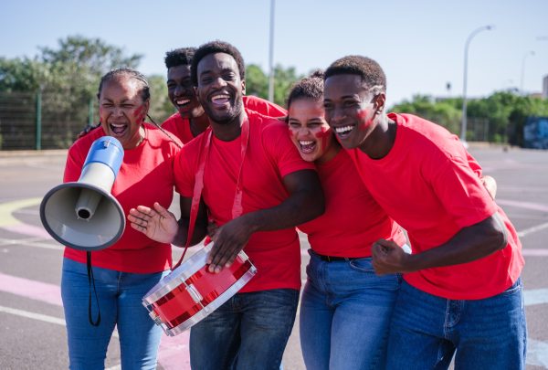 Group of fans of African teams cheering with joy for their team in the World Cup Group of fans of African teams cheering with joy for their team in the World Cup