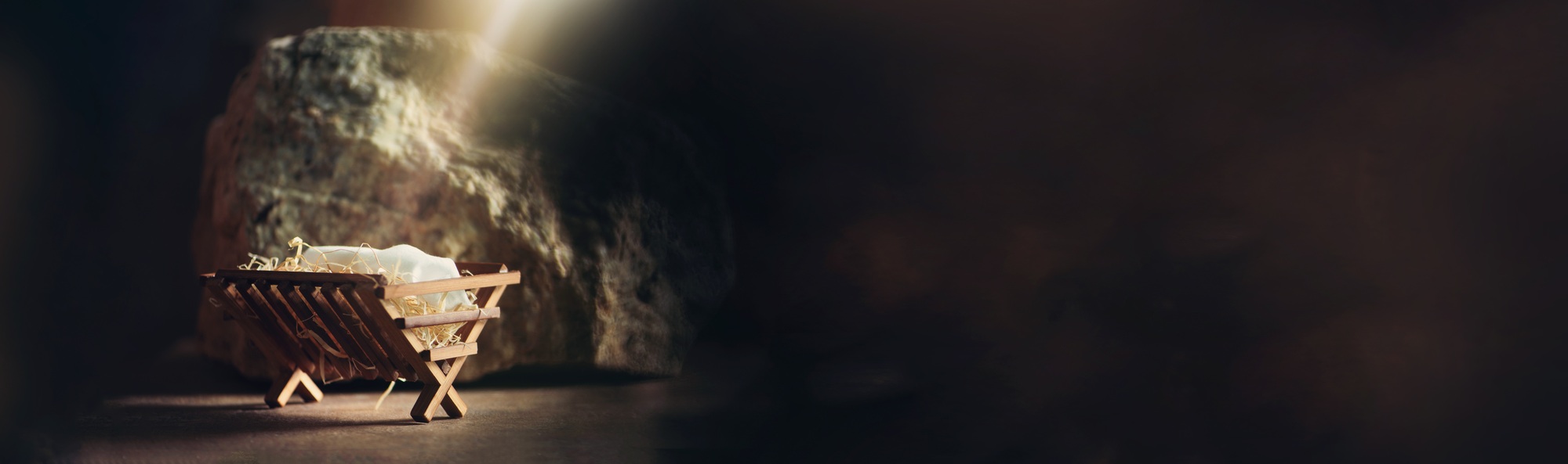 Wooden manger in cave background. Christmas. Salvation, Messiah, Emmanuel, God with us, hope