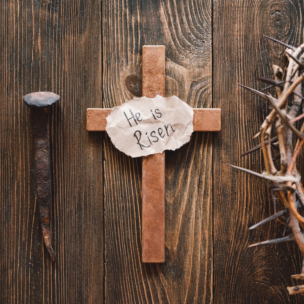 He is Risen. Jesus Crown Thorns and nails and cross on a wood background. Easter Day
